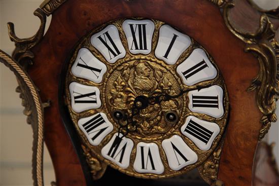 A Louis XVI style ormolu mounted burr wood mantel clock and pedestal, overall height 5ft 4in.